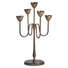 a brass candelabra with five candles on it