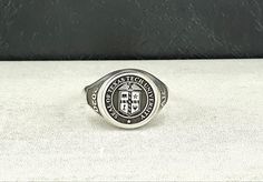 "Made to order - 925 sterling silver signet ring engraved with your college logo, your family crest or any other image that you request. No extra cost for side engravings. ✔Ring Details Metal: 925 Sterling SILVER Face Sizes (diameter): Small (10 mm), Medium (13 mm), Large (16 mm), X Large (19mm) After placing your order please send us a HIGH QUALITY digital image you would like me to use. Even if I have already been in contact with you PLEASE attach in the \"notes\" section your Size, Color and 1976 Class Ring, High School Rings, Class Rings College, University Rings, Class Rings High School, School Rings, Super Bowl Rings, Class Rings, College Class