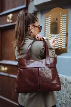 "This Brown cowhide leather bag is 100% handmade. this large tote bag is suitable for carrying everything in your everyday life. It has a Zipper Closure and Cross-Body strap. The bag has a cotton lining and it has 3 inner pockets. as you can see it made by really high-quality Italian leather.this leather calls \"Pelle Conciata Al Vegetale\", which means that the leather is tanned with only natural materials. Dimentions: - Width ( top of the bag ) : 32 Cm / 12.5'' ( Bottom of the bag ) : 37 Cm / Leather Shoulder Bag For Errands, Brown Tote Shoulder Bag With Handles, Brown Tote Briefcase With Handle Drop, Leather Satchel Shoulder Bag For Errands, Brown Tote Shoulder Bag For Everyday Use, Chic Brown Briefcase With Large Capacity, Leather Satchel Weekender Bag With Handles, Daily Use Shoulder Bag With Leather Lining, Chic Brown Tote Weekender Bag