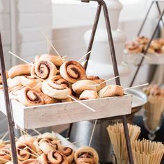 rolls and straws are on display at a buffet