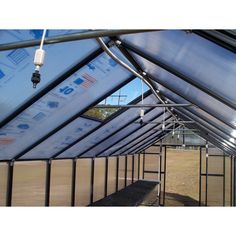 the inside of a greenhouse with metal pipes