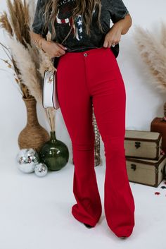 These show-stopping cherry red flares are made for those days when plain blue jeans just simply won't cut it. Gorgeous and ready to take the town! Ultra High Rise Fabric: 76% Cotton, 20% Polyester, 4% Spandex Details: Two back pocket design, button closure with zipper fly, ultra comfortable, breathable fabrication. Imported Fit: True to size- Ultra high rise- If you are in between sizes, size down- Very Stretchy- Ultra comfortable- Inseam: 31"Model Specs: Emily is wearing a size small in the pho Stretch Flare Jeans For Night Out, Red Mid-rise Bottoms For Fall, Trendy Stretch Red Bottoms, Red High Waist Flare Jeans For Spring, Chic High Waist Red Jeans, Red Flared Bottoms For Spring, Red High Rise Flare Jeans For Fall, High Rise Red Flare Jeans For Fall, Fitted Red Flare Jeans For Spring