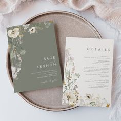 the wedding stationery is laid out on top of a plate and next to it's menu