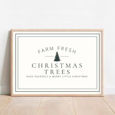 farm fresh christmas trees sign on a wooden floor in front of a white wall with the words,'farm fresh christmas trees have yourself a merry little christmas '