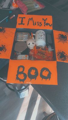 an orange box with halloween decorations in it