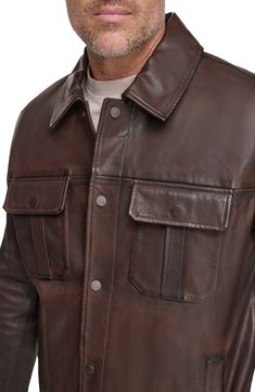 Workwear-inspired design defines a ruggedly handsome jacket built from fine lamb leather. 30" length Spread collar Leather Professional leather clean Imported Rugged Leather Jacket With Button Closure For Work, Masculine Long Sleeve Leather Jacket For Work, Long Sleeve Leather Jacket For Work, Rugged Leather Jacket For Workwear, Rugged Leather Jacket With Long Sleeves For Work, Rugged Leather Outerwear, Rugged Leather Jacket With Button Closure, Collared Leather Outerwear, Fall Leather Jacket With Snap Buttons