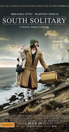 a movie poster for the film south solitary with a woman holding a suitcase and a cat