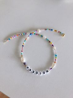 "Custom word/letter beaded necklace with pearls s handmade from the best materials. You can buy it as a gift for a friend, sister, mother. BEADS SIZE : The pearls are 4-9mm (0.15 - 0.35 inch), and the beads are 2-4 mm (0.07 - 0.15 inch). CUSTOMIZE THE NECKLACE: Choose a letter/word or name for your necklace. IMPORTANT: A chain is added to each choker for additional control. IMPORTANT INFORMATION: *Created in a pet-free and smoke-free home. * Perfect for someone with sensitive skin *There may be White Necklace For Friendship And Mother's Day, White Necklace For Friendship On Mother's Day, Trendy Birthday Necklace With Letter Beads, Trendy Personalized Beaded Necklaces For Gifts, White Letter Beads Necklace For Friendship, Trendy Personalized Round Bead Necklace, White Necklaces With Colorful Beads For Friendship, Adjustable Mother's Day Necklace With Letter Beads, Handmade White Name Necklace For Mother's Day