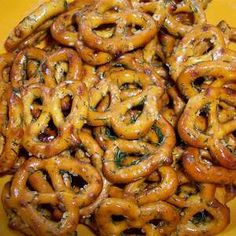 a pile of pretzels sitting on top of a yellow plate