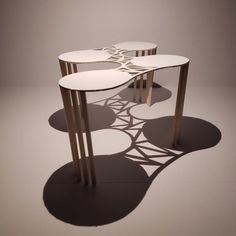 three tables are arranged in the shape of an abstract design on a white background with shadows