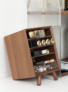 a wooden shelf with several different items in it