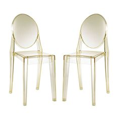 two clear chairs sitting side by side next to each other