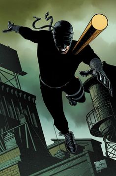 a man flying through the air while holding a baseball bat in one hand and wearing a mask