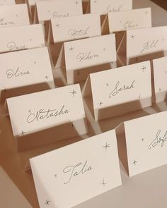 there are many place cards with names on them for guests to write in the box