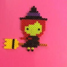 a pixel art piece made out of legos on a pink background with the image of a cartoon character