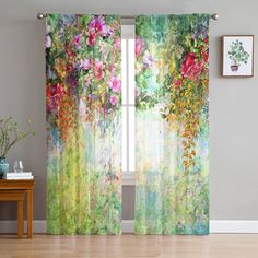 an open window with flowers on it and curtains hanging from the side, in front of a wooden table