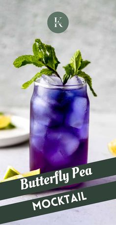 a purple drink in a glass with mint garnish on the rim and text that reads, butterfly pea mocko cocktail