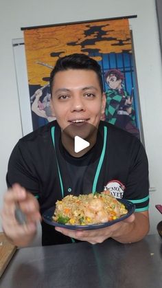 a man holding a plate of food in front of his face with the caption