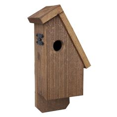 a wooden birdhouse with a hole in the roof