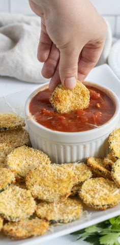 Zucchini chips on a platter with a hand dipping a breaded zucchini chip into marinara. Keto Eggplant Recipes, Healthy Eggplant Recipes, Keto Eggplant Parmesan, Baked Eggplant Fries, Oven Baked Eggplant, Oven Fried Zucchini, Eggplant Recipes Healthy, Keto Eggplant, Aubergine Recipes