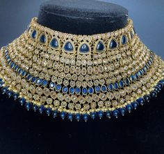 This elegant and gorgeous choker with matching earrings and tikka is sure to be a hit for any event! The neutral colors can match any outfit and the colors are perfect for any occasion! It comes in beautiful tones with a midnight blue color and a blush pink and darker pink color. It hugs the neck and is made of high quality stones. Ceremonial Heavy Kundan Choker Necklace, Heavy Kundan Choker For Receptions, Kundan Choker With Stone Work For Reception, Heavy Chandbali Choker For Reception, Traditional Heavy Choker For Reception, Reception Stone Work Kundan Choker, Ceremonial Bollywood Heavy Choker, Dark Blue Jewelry, Blue Jewelry Set