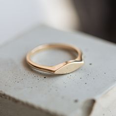 The Interleaf Signet Ring is crafted with 14k gold and a modern update on a classic design. This simple and elegant signet ring is perfect for everyday wear. Gold Thumb Rings, Bezel Necklace, Silver Flats, Cuff Rings, Cluster Necklace, Thumb Rings, Letter Necklace, Bezel Diamond, Chain Earrings