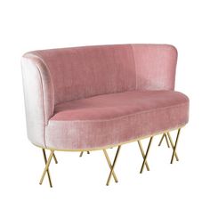 a pink couch sitting on top of a metal frame