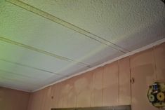 the ceiling in this kitchen has been stripped off