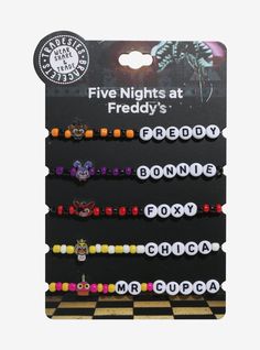 Make sure you're matching with your squad before you head to the Pizzaplex! This set of bead bracelets from Five Nights at Freddy's features your favorite animatronics' names spelled out  plus a chibi enamel charm of them.Acrylic; nickel-free alloy; elasticSet of 5AdjustableImported 3 Person Friendship Necklace, Character Themed Bracelets, Cavetown Bracelets, Pokémon Bracelet, Fnaf Bracelet Ideas, Fnaf Bracelet, Cool Beaded Bracelets, Matching Kandi Bracelets, Matching Bracelets For Best Friends