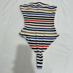 Strapless Out From Under Bodysuit From Urban Outfitters. Size Medium. Never Worn. Striped Stretch One-piece Bodysuit, Casual Striped One-piece Bodysuit, Striped Stretch Bodysuit For Summer, Striped Stretch Summer Bodysuit, Striped Sleeveless Summer Bodysuit, Striped Sleeveless Bodysuit For Beachwear, Urban Outfitters One-piece Bodysuit For Summer, Urban Outfitters One-piece Summer Bodysuit, Summer One-piece Bodysuit By Urban Outfitters