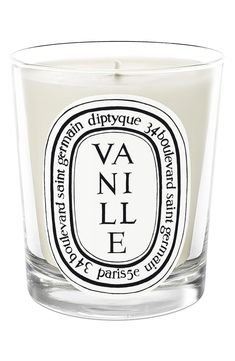 a candle that is sitting in front of a white background with the words vanilla on it