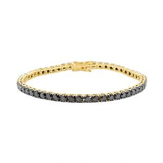 This Gold Black Diamond Tennis Bracelet features black diamond set in 14k Yellow Gold. Measures 7 inch Gold 6.85 grams Black Diamond 7.30 cts Description: Introducing the striking Gold Black Diamond Tennis Bracelet from Monisha Melwani – a bold and sophisticated piece that redefines luxury. This exquisite bracelet features a series of meticulously selected black diamonds, each set in a lustrous gold setting. It's a perfect statement piece that combines the timeless allure of tennis bracelets wit Fine Black Jewelry Bracelet, Luxury Black Diamond Bracelet With Round Shape, Black Diamond Round Bracelet, Classic Tennis Bracelet With Black Diamonds, Formal Tennis Bracelet With Black Diamonds, Classic Round Black Diamond Bracelet, Black Diamond Round Tennis Bracelet, Classic Tennis Bracelet With Black Diamonds For Formal Occasions, Classic Black Diamond Bracelet For Formal Occasions