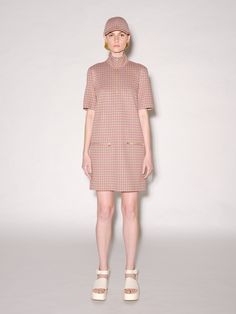 A ‘60s-style shift dress silhouette is cut in seasonal Houndstooth Check Jacquard. The slick, crisp fabric imparts perfect movement to the straight-fit dress, which is finished with polished goldtone zippers for a dimensional touch to the easy shape. An exclusive fabrication for the season, the Houndstooth Check Jacquard is similar to our Interlock Jersey with a slightly slick hand and added elastic to contour the body. It's produced by an Italian mill certified for its sustainable practices by 60s Style, Rosetta Getty, Easy Shape, Sustainable Practices, 60s Fashion, Fit Dress, Dress Silhouette, Fitted Dress, Shift Dress