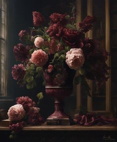 a vase filled with pink flowers on top of a wooden table next to a window