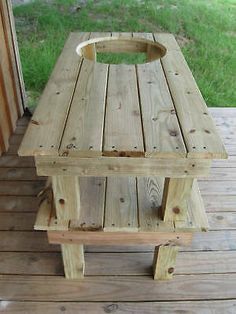 a wooden bench sitting on top of a porch