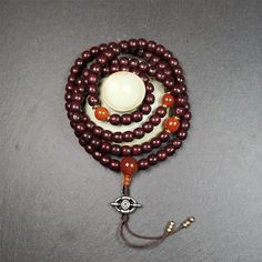 ❤This mala is made by Tibetan craftsmen and come from Hepo Town, Baiyu County,Tibet, the birthplace of the famous Tibetan handicrafts.It's composed of 108 pcs 9mm lotus seed beads,with agate spacer beads,and agate bead counters,diameter 0.35",circumference 35".❤Details:Mala'perimeter is 88cm,35 inches.108 lutus seed beads approximately 9mm / 0.35 inch.1 × agate main bead,diameter 12mm × 10mm / 0.47 × 0.4 inch.2 × agate spacer beads diameter 10mm / 0.4 inch.1 × agate guru bead,22mm × 13mm / 0.87 Spiritual Mala With 8mm Beads, Bohemian 108 Beads Round Mala, Bohemian Mala With 108 Round Beads, Bohemian Mala With 108 Beads, Traditional Jewelry For Meditation With 8mm Beads, Brown Mala With 8mm Beads For Puja, Traditional 8mm Beads Jewelry For Meditation, Traditional Handmade Beaded Bracelets For Meditation, Traditional Jewelry With 8mm Beads For Meditation