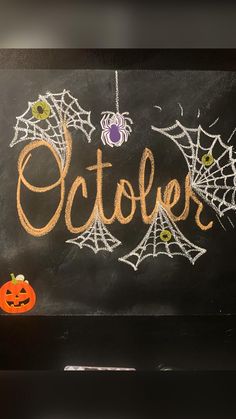 a chalk board with the word october written on it