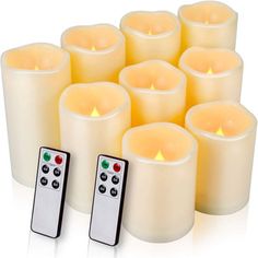 twelve candles with remote controls in front of each other on a white background, set next to each other