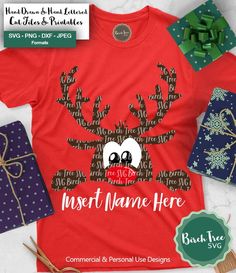 a red shirt with reindeer's head and antlers on it next to presents