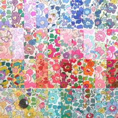 a colorful patchwork quilt with flowers on it