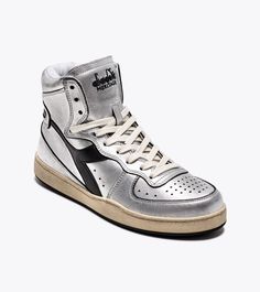 Sporty Silver Leather Sneakers, Classic Silver High-top Sneakers, Classic Silver Sneakers, Silver Lace-up Sneakers With Rubber Sole, Silver Leather High-top Sneakers For Streetwear, Metallic Silver Leather Sneakers With Round Toe, Sporty Silver High-top Sneakers With Round Toe, Modern Silver Sneakers With Rubber Sole, Luxury Silver Sneakers With Rubber Sole