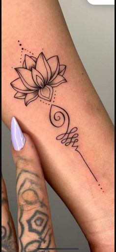 a woman's foot with a tattoo on it and a flower in the middle