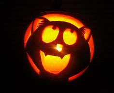 a pumpkin carved to look like a cat