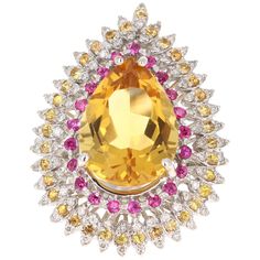 This ring has a natural Pear Cut Citrine that weighs 11.42 carats. The Citrine measures at 19 mm x 14 mm and has a beautiful golden yellow hue. The pink sapphires that adorn the ring weigh 0.84 carats and the yellow sapphires weigh 0.86 carats. There are 72 Round Cut Diamonds that weigh 0.52 carats. The total carat weight of the ring is 13.64 carats. The ring is set in 14 Karat White Gold and weighs approximately 12.5 grams. Gorgeous statement piece! It is a ring size 7 and can be resized at no Gold Cocktail Ring, Pink Men, Gold Cocktail, Sparkle Jewelry, Pretty Rings, Yellow Sapphire, Golden Yellow, Sapphire Diamond, Pear Cut