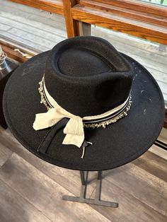 Discover the rugged charm of our Burned Western Hat. This unique, handcrafted cowboy hat features a distressed look, giving it a vintage, well-worn appeal perfect for Western enthusiasts and fashion-forward individuals. Features: Handcrafted Design: Each hat is meticulously burned and distressed to achieve a one-of-a-kind look. Premium Materials: Made from high-quality materials for durability and comfort. Unique Aesthetic: The burned finish adds a distinctive vintage style that sets it apart. B Handmade Black Fedora For Rodeo, Black Bohemian Felt Hat For Western-themed Events, Black Rustic Adjustable Hat, Black Bohemian Felt Hat For Kentucky Derby, Bohemian Black Hat Bands For Ranch, Black Rustic Hat For Rodeo, Rustic Black Hat For Rodeo, Rustic Wide Brim Hat For Festival, Bohemian Black Hat Band For Western-themed Events