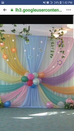 an image of a decorated stage with balloons and streamers