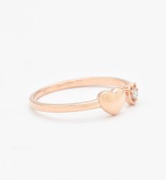 Certified Real Diamond Open Heart Ring set with Diamond, size 2 millimeters diameter, 0.03 Carats.Solid 14k Rose Gold ☞ made to last.Click here for ☞ Solid Gold CollectionDiamond Details:• CERTIFIED Natural Diamond• Weight: 0.03 Carats• Dimensions: 2mmSolid Gold Details:• 1.2 grams of 14k Solid Rose Gold• Dimensions: Band width ≈ 1.5mm, thickness ≈ 1mm• Lasts a lifetime - Perfect for everyday use (won’t tarnish)! *Final weight & dimensions depending on the chosen ring sizeSKU RT-1543 14k Rose Gold Stackable Promise Rings, 14k Gold Heart Ring With Single Diamond For Gift, Valentine's Day Single Diamond Ring In Fine Jewelry Style, Promise Ring In Rose Gold With Single Diamond, Rose Gold Promise Ring With Single Diamond, Stackable Rose Gold Heart Ring In 14k Gold, Stackable 14k Rose Gold Heart Ring, Dainty Heart-shaped Rose Gold Diamond Ring, Dainty Rose Gold Heart-shaped Diamond Ring