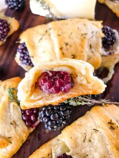 several pastries with berries and herbs in them