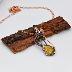 ITEM DETAILS Item Type ~ Pendant with Chains  Gemstone Name - Hydro Citrine Metal ~ Copper Wire Pendant Size :-  "Length: 2.5 Inches Width: 0.7 " Inches Quantity ~ 1 Piece Polish ~ Oxidized Why Copper :  The folk medicine tradition of wearing a copper bracelet has been around for thousands of years. Proponents believe that wearing the bracelet allows trace amounts of copper, an essential mineral, to rub off into the skin and be directly transferred into the bloodstream. Wearing a copper bracelet Copper Wire Teardrop Pendant Jewelry Gift, Copper Wire Teardrop Pendant Jewelry For Gift, Yellow Metal Necklace As Gift, Yellow Metal Necklace For Gift, Gold Necklace With Copper Wire As Gift, Amber Pendant Jewelry With Lobster Clasp, Teardrop Copper Wire Jewelry For Gifts, Yellow Metal Pendant Jewelry, Yellow Pendant Jewelry With Lobster Clasp