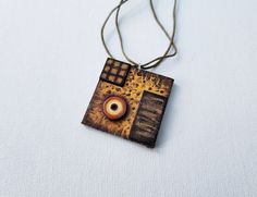 This beautiful square pendant necklace is made of wood, painted with high quality acrylic paint, and paper. The base of the pendant is a wooden square, the circle on top of the square is a quilled paper coil, and the small square and the rectangle are made of wood. The string of the necklace is adjustable. The pendant is varnished for protection. This pendant necklace can be a perfect gift for someone who loves abstract geometric designs and unusual jewelry pieces. * Keep in mind that all computer monitors display color differently, so the jewelry may differ slightly in color from the image you see onscreen. Square Pendant Necklace, Unusual Jewelry, Square Pendant, Computer Monitors, Geometric Designs, Geometric Design, Acrylic Paint, Jewelry Pieces, Necklace Etsy